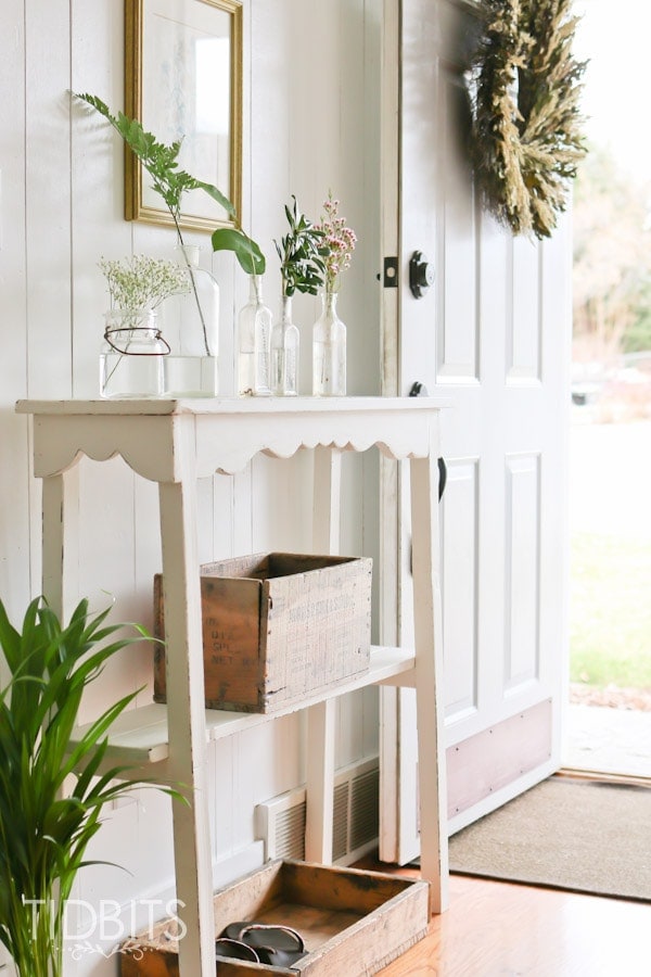 Spring Home Tour by TIDBITS - Freshen up an entry way with free or on a dime greenery placed inside jars.