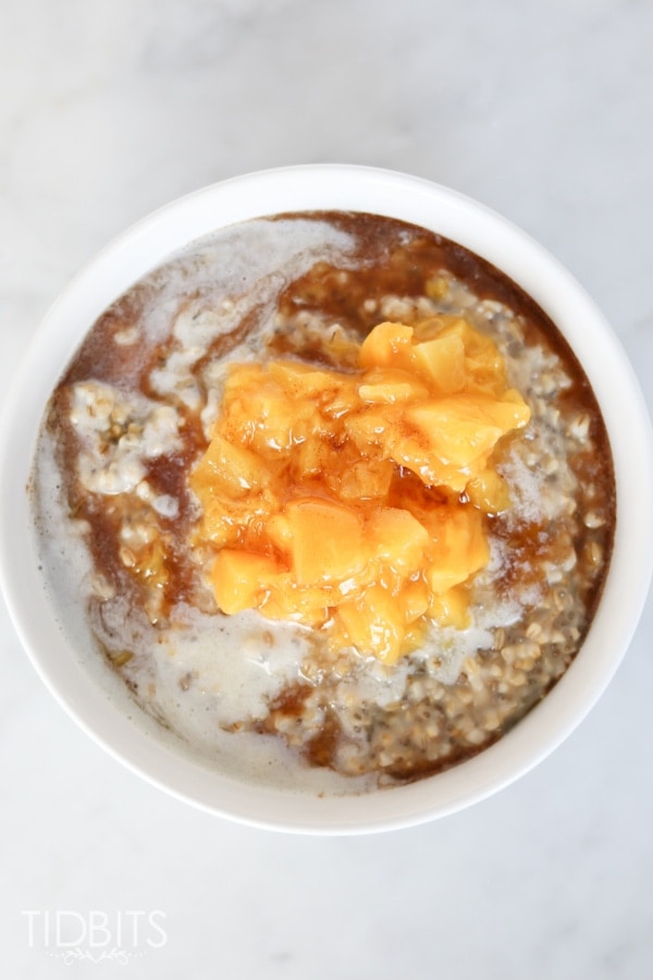 Pressure cooker or slow cooker peaches and cream steel cut oats, with a cinnamon maple drizzle.