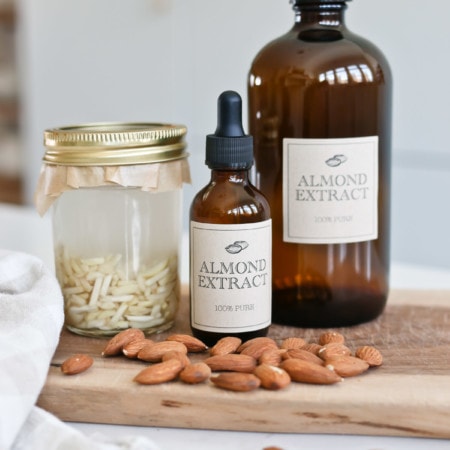 Glass bottles and jars of homemade almond extract