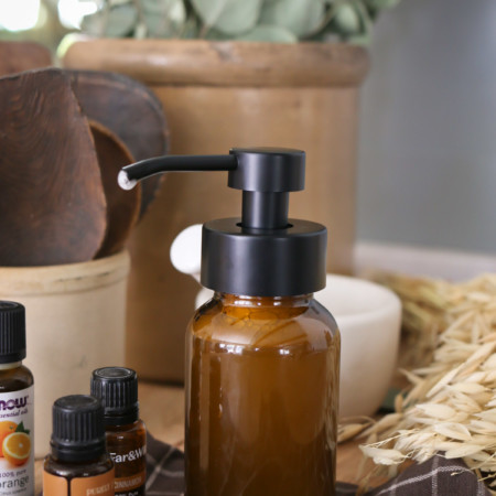 A bottle of foaming hand soap made with essential oils