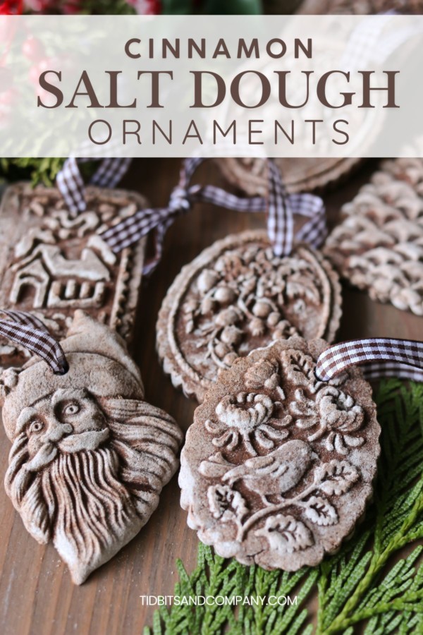 An assortment of homemade cinnamon salt dough ornaments rest on a table