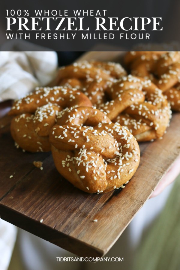 Big, soft, fluffy pretzels made from a whole wheat flour recipe are arranged on a table