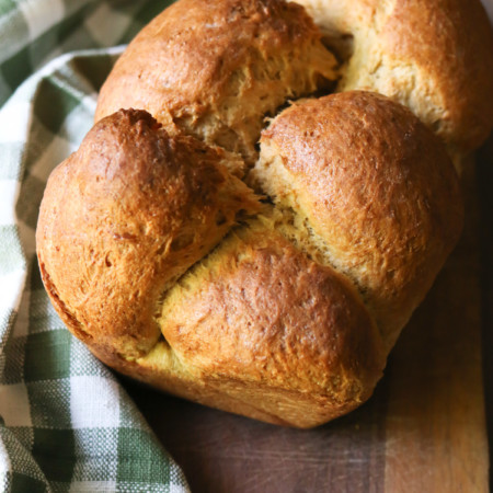 A loaf of brioche bread made from a 100% whole wheat recipe