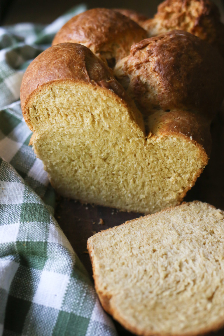 A sliced loaf of freshly-baked homemade brioche bread