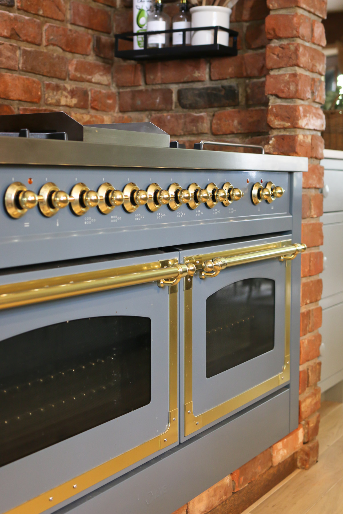 A close up view of a blue gray Italian ILVE range