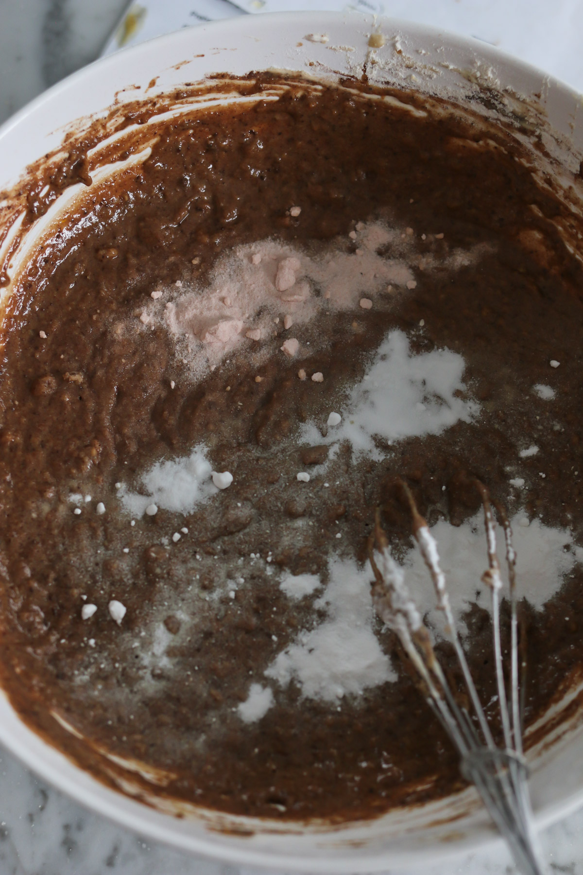 Chocolate batter is being mixed before baking