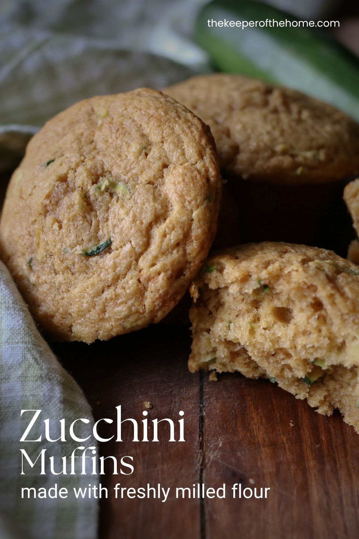 Several zucchini muffins made from fresh milled whole wheat flour are arranged in a group